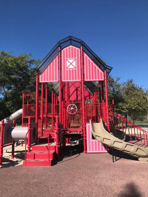 The play structure has lots of shapes! A square and triangles near the roof. Rectangles in the stairs and the side panel. Circles in the wheels. Cylinders in the tunnel and one slide. More rectangles on the back of the slide.