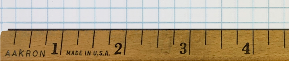 A ruler measuring up to 4 and 1-half inches on quarter-inch grid paper.