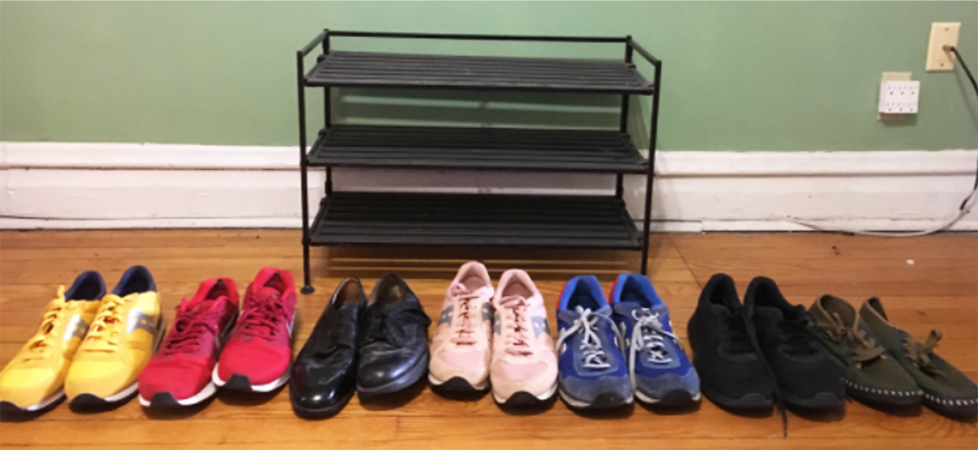 My empty shoe rack has a top shelf, a middle shelf, and a bottom shelf. Each shelf can probably hold 3 pairs of shoes. I have 7 pairs of shoes to put on the shoe rack.