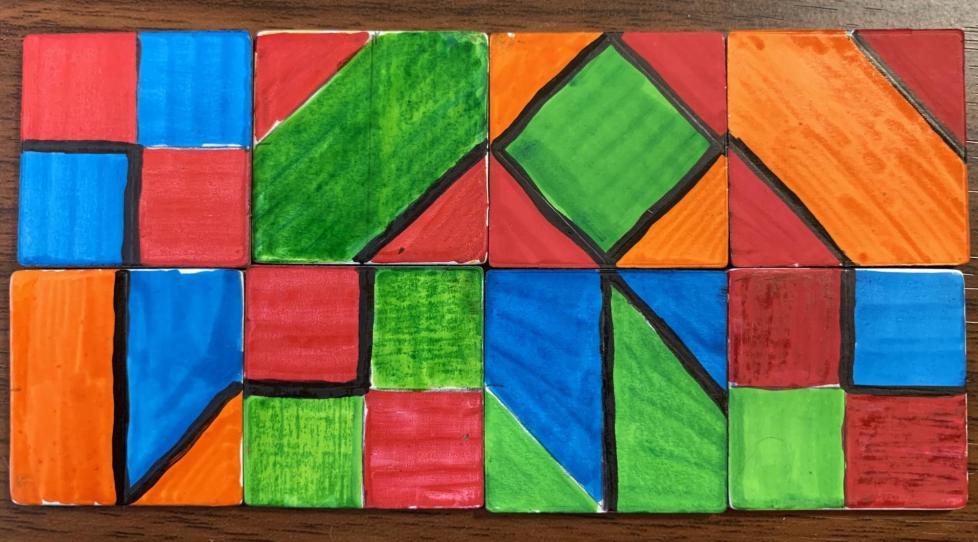 Colored tiles are arranged in a 2 by 4 array. The colors make shapes that cover parts of each tile. A dark line around the edge of some shapes snakes across the tiles. The shapes include squares, triangles, quadrilaterals, and hexagons.